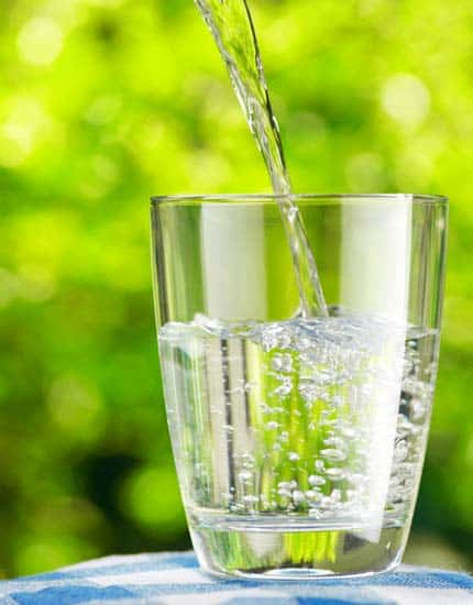 Pouring purified water into a glass