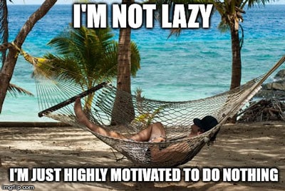 man lying in a hammock on the beach